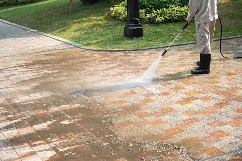 Concrete driveway being pressure cleaned by our professional concrete pressure cleaning service